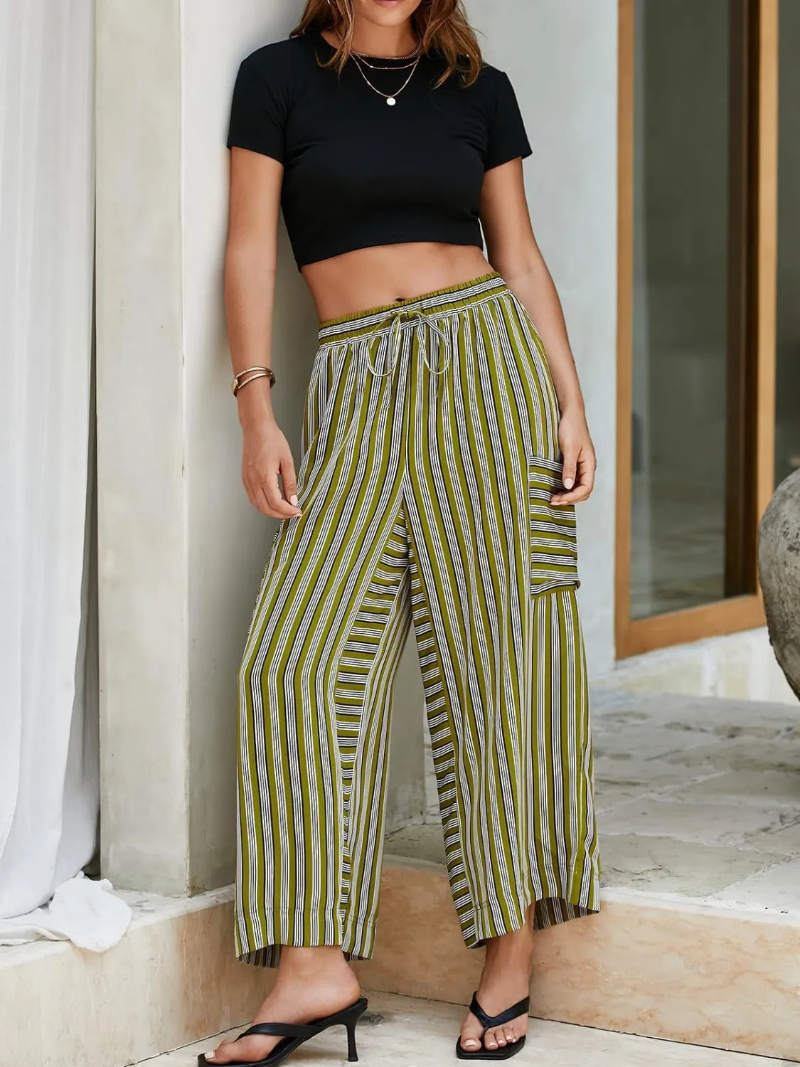 Moss green striped cargo culottes with drawstring waist and side pockets.