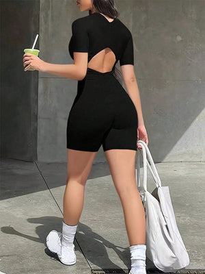 Black short-sleeve romper with a cutout back detail and biker shorts.