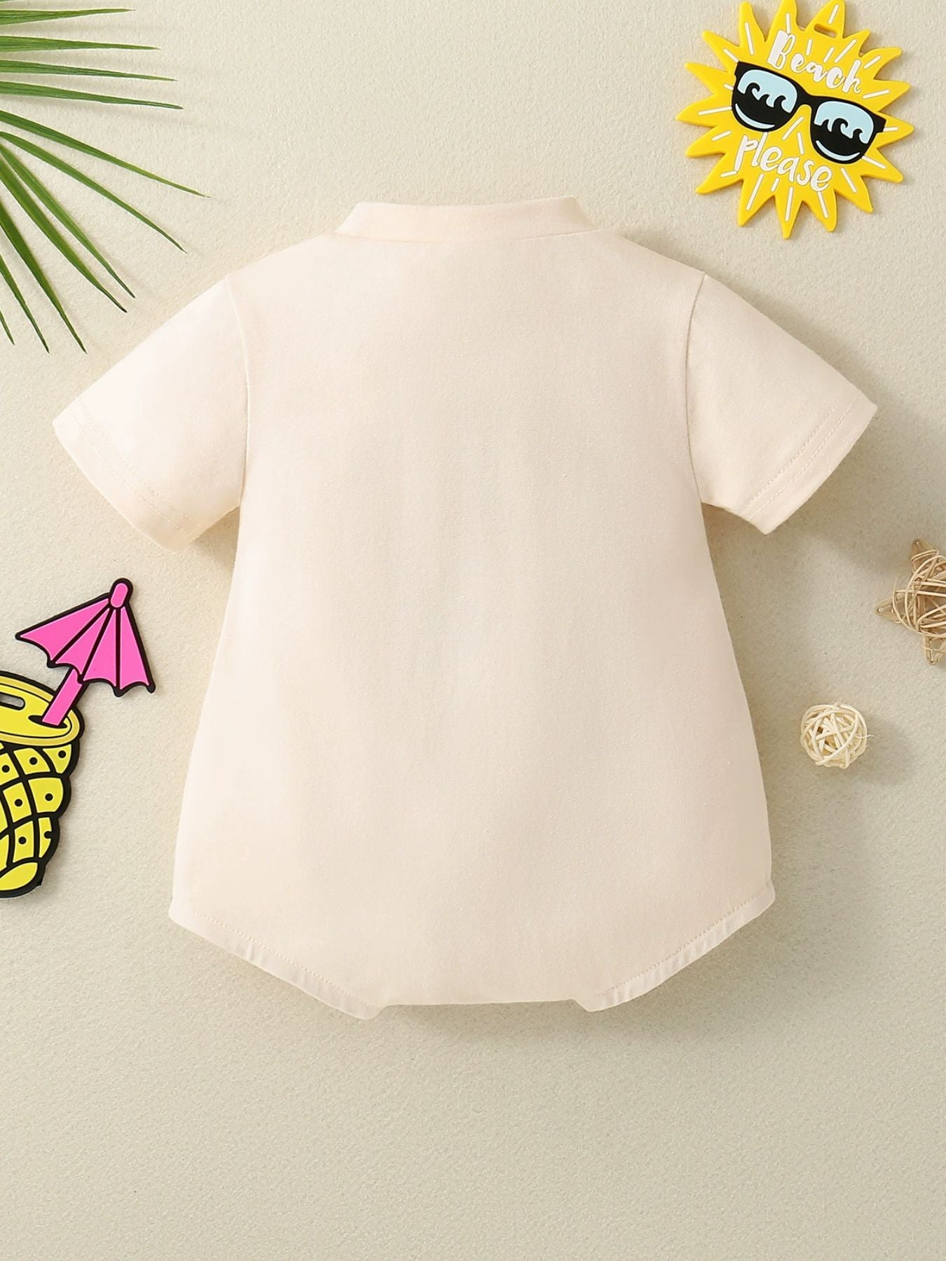 Baby beige short-sleeve bodysuit with a mock neck.