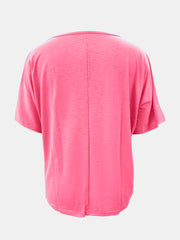 Relaxed V-neck tee in strawberry pink with dolman sleeves and textured fabric.