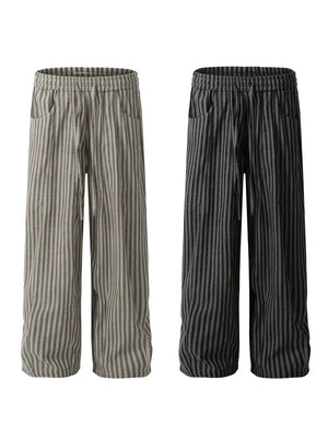 Men's striped drawstring sweatpants in black and gray cotton with pockets.