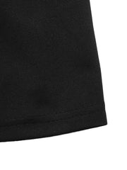Black A-line mini dress hem detail with visible stitching.