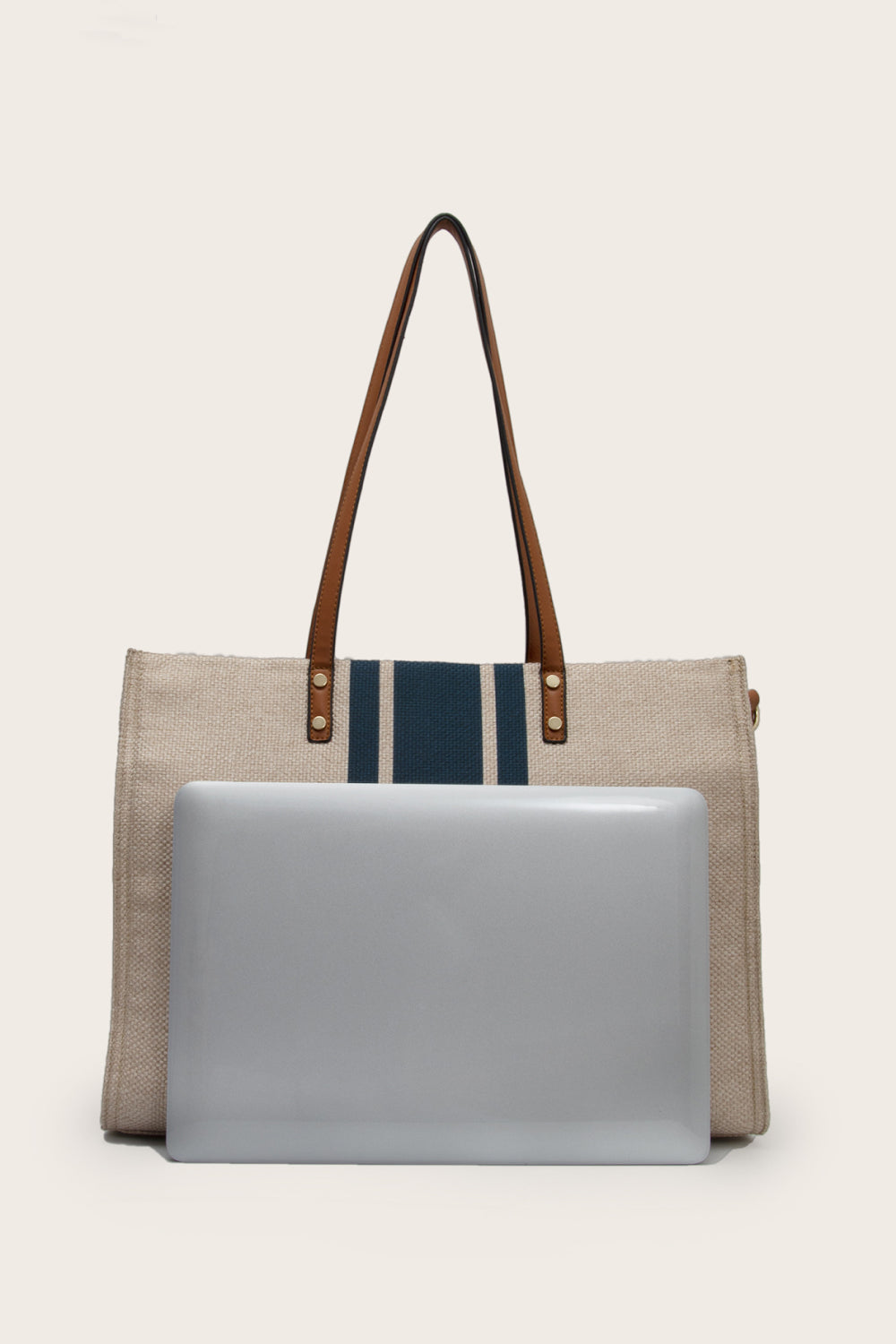 Nautical canvas tote bag in Khaki with navy stripes and brown leather trim.