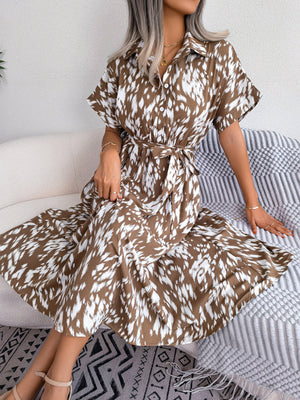 Mocha dalmatian print midi shirt dress with tie waist and short sleeves.