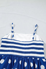 Blue and white striped smocked maternity swim dress with polka dot skirt and spaghetti straps.