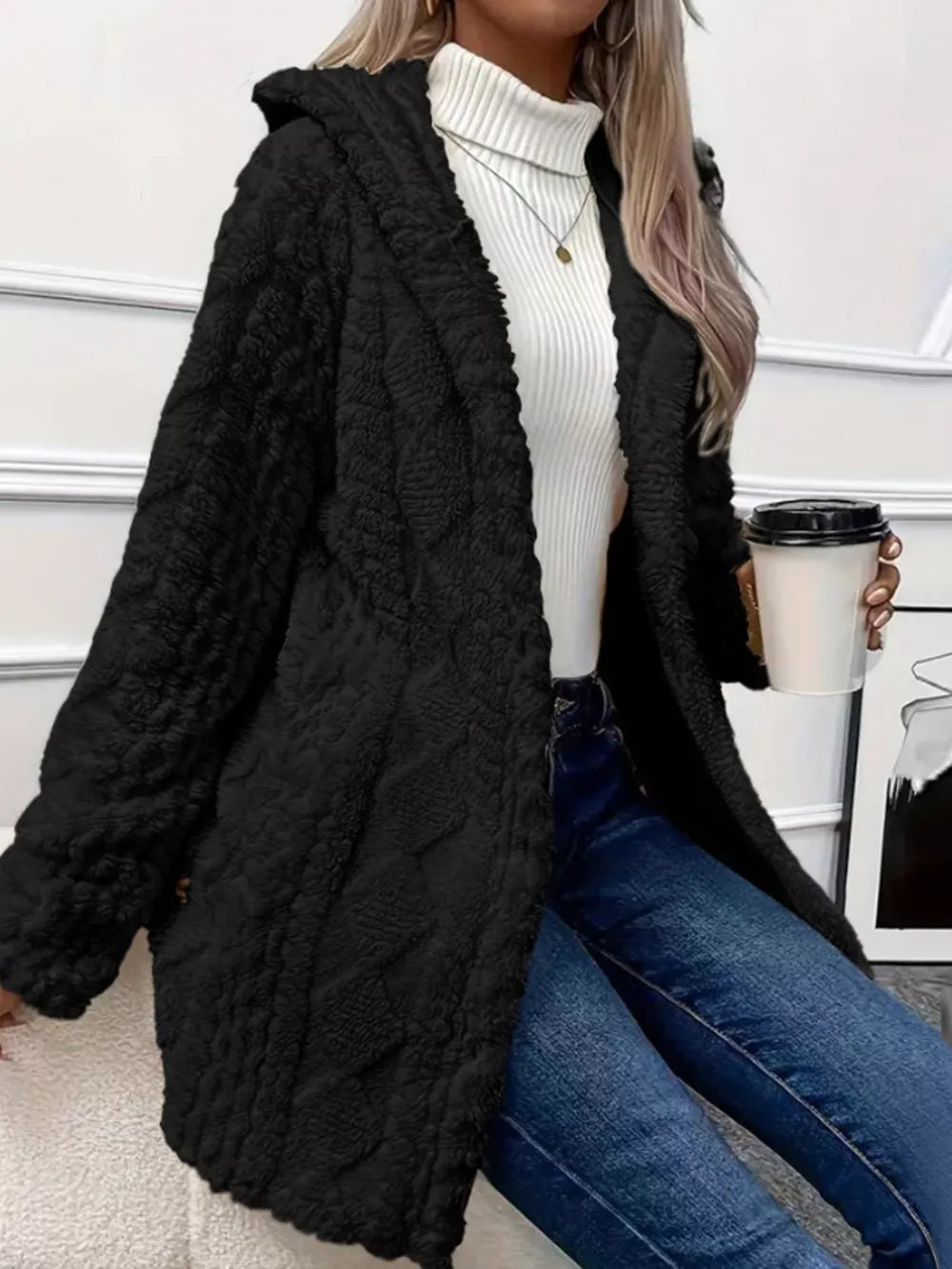 Black hooded teddy coat with textured pattern and button detail