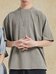 Oversized washed cotton tee in gray with a crew neck and short sleeves.