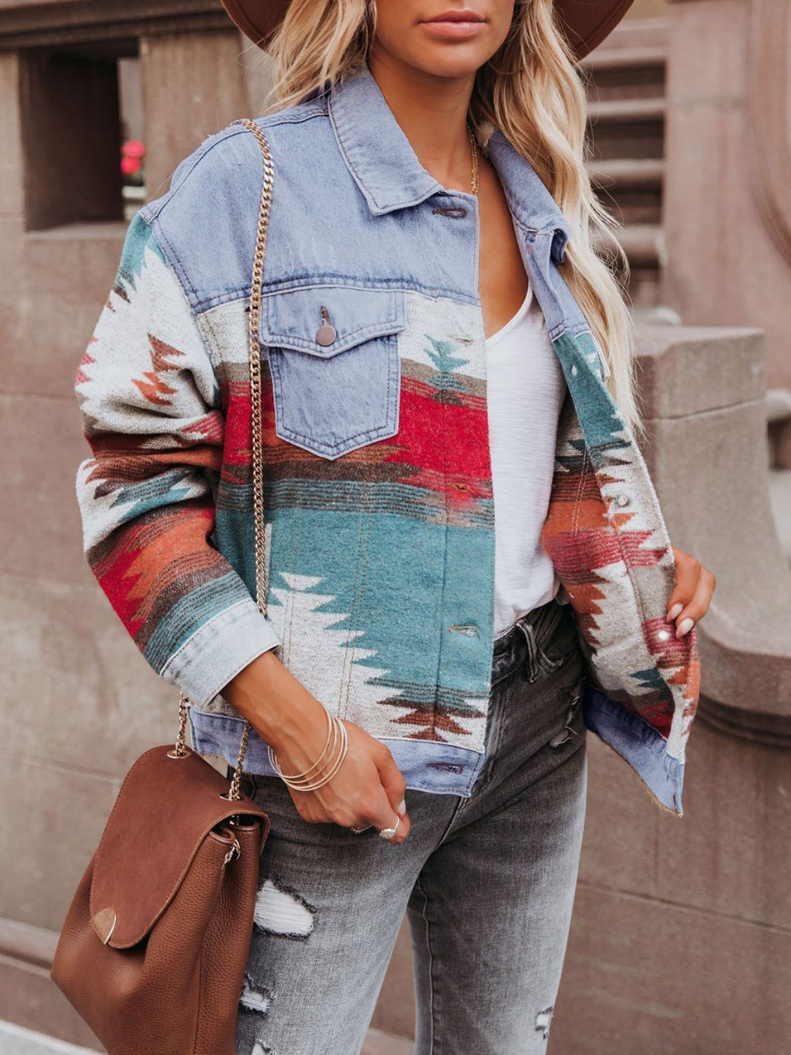 Light blue denim jacket with Aztec pattern, button front, and chest pockets.