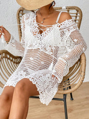 White crochet lace-up cover-up dress with tassels and bell sleeves.