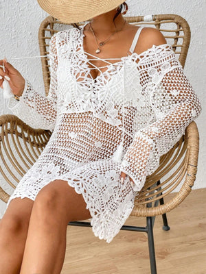 White crochet lace-up cover-up dress with tassels and bell sleeves.