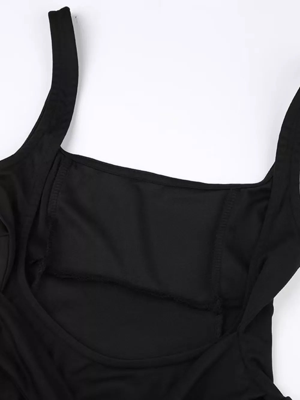 Black mini dress with square neckline and backless detail