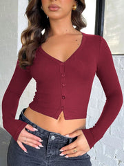 Burgundy ribbed V-neck crop top with button front and long sleeves.
