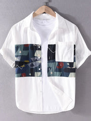 White short sleeve men's shirt with geometric print panel and button-down front.
