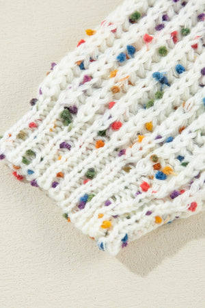 White confetti knit sweater with textured stitch detail and colorful speckles.