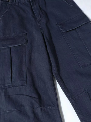 Blue casual cargo pants with flap pockets and button closure.
