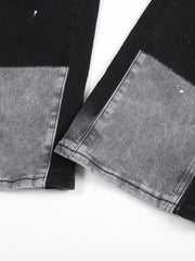 Split panel bootcut jeans in black and light gray with paint splatters.