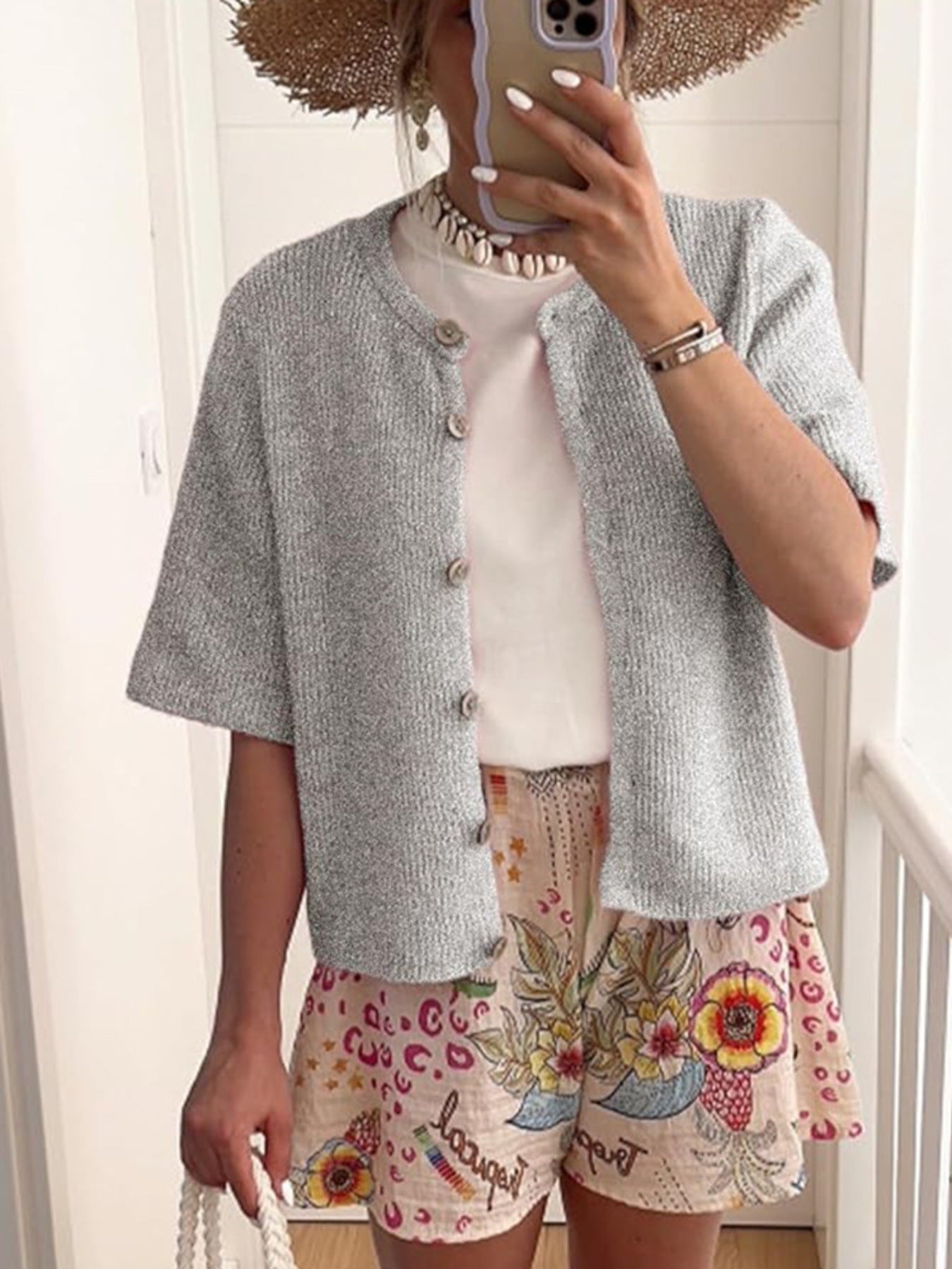 Gray ribbed button-down cardigan with short sleeves and a slightly cropped length.