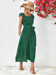 Forest green tiered midi dress with flutter sleeves and a belted waist.
