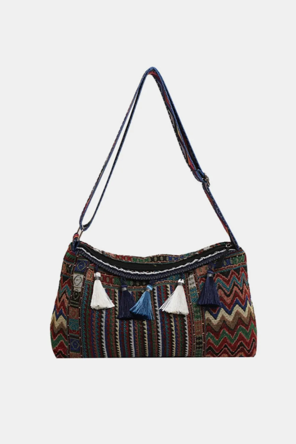 Geometric embroidered shoulder bag with tassels and a colorful chevron pattern.