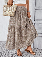 Tiered maxi skirt in mocha with a delicate floral print and smocked waist.