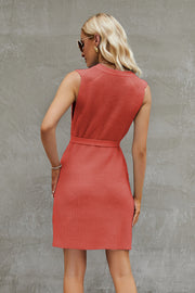 Coral belted knit tank dress with a textured pattern and A-line cut.