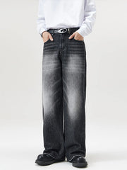 Men's wide-leg wash denim jeans in black with a faded effect.