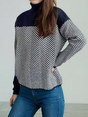 Chevron knit turtleneck sweater with colorblock dark blue top and sleeves.
