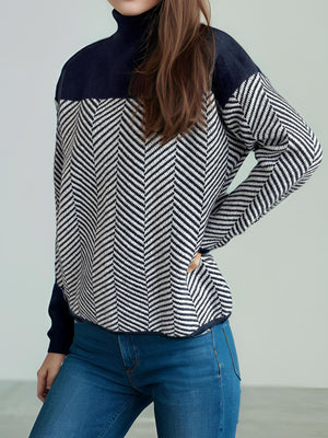 Chevron knit turtleneck sweater with colorblock dark blue top and sleeves.