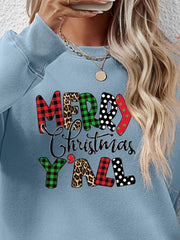 Misty Blue graphic sweatshirt with Merry Christmas Y'all text in mixed prints like plaid, leopard, polka dot.