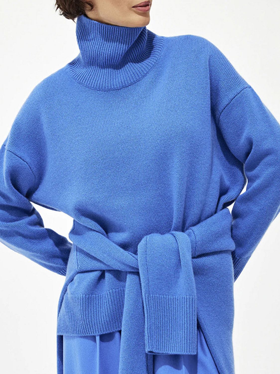 Relaxed fit ribbed turtleneck sweater in Royal Blue with a tie waist detail.