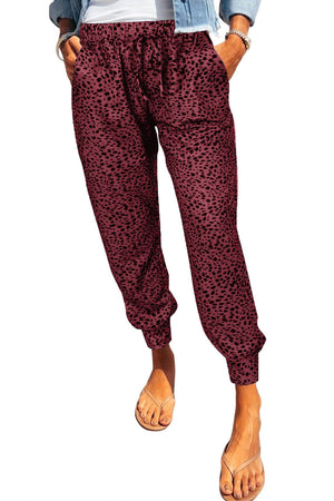 Shadow Leopard Relaxed-Fit Drawstring Trousers in Wine with black leopard print, cuffed ankles.