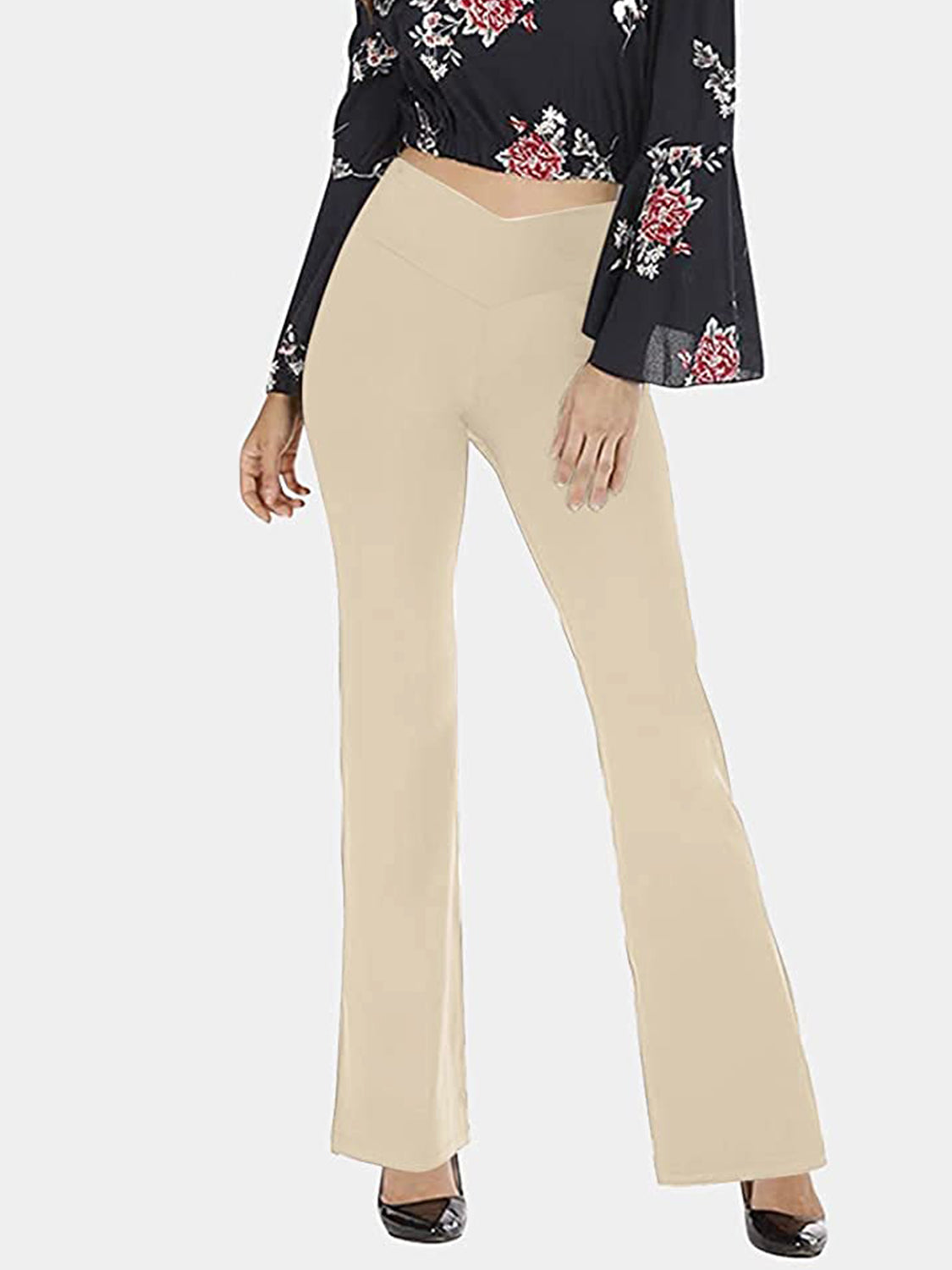 Sand V-waist flare leg activewear pants with a high rise and bootcut hem.