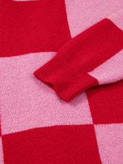Checkerboard knit cardigan in deep rose with ribbed cuffs and hem detail.