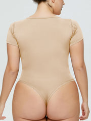 Tan short sleeve bodysuit with square neckline and thong back