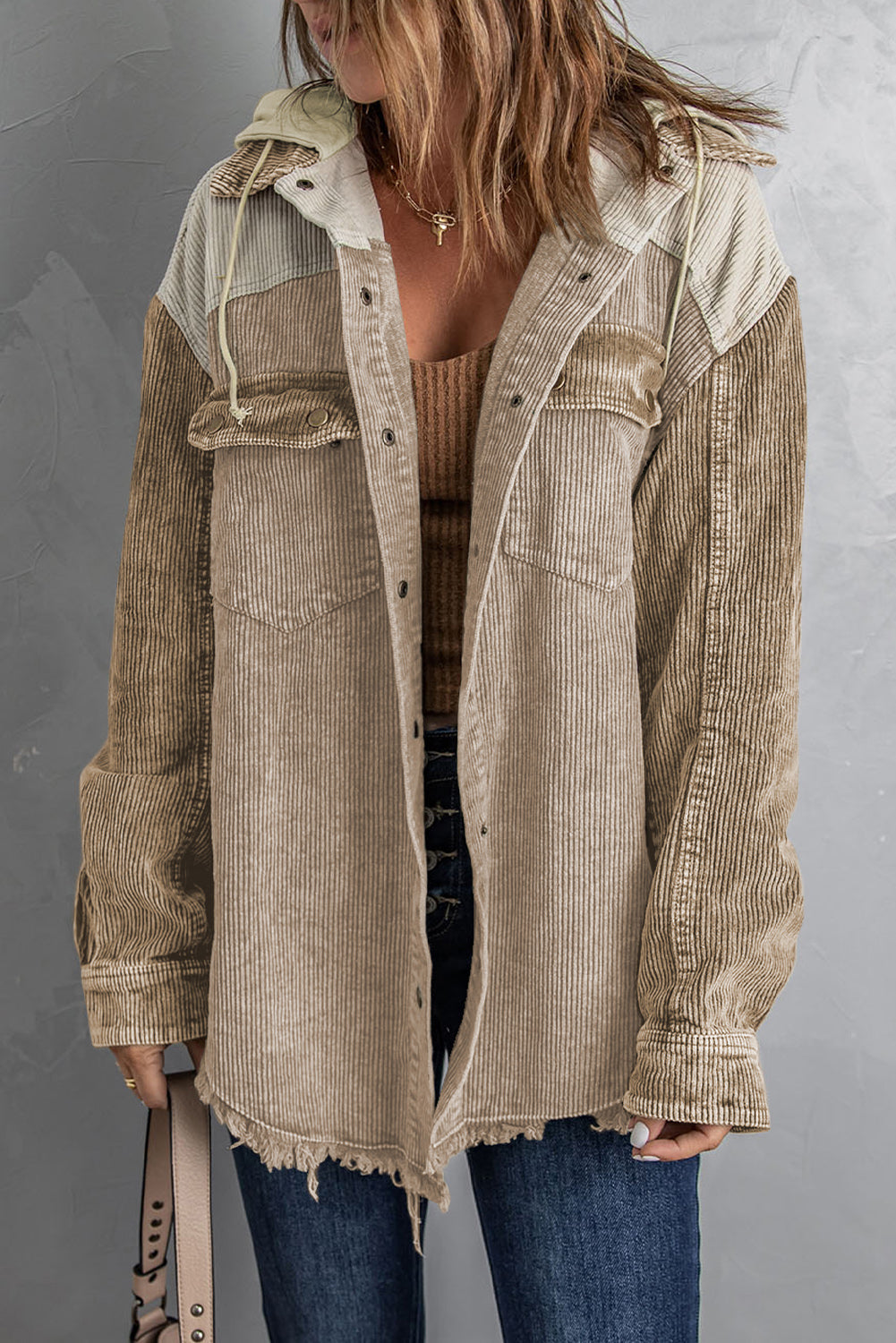 Colorblock corduroy hooded utility jacket with frayed hem and chest pockets.