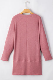 Dusty pink waffle knit open front cardigan with long sleeves and a relaxed fit.