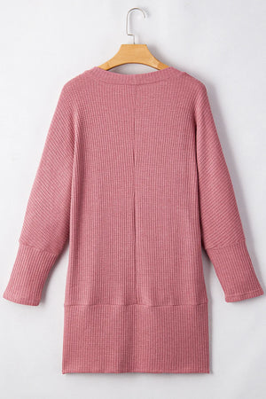 Dusty pink waffle knit open front cardigan with long sleeves and a relaxed fit.