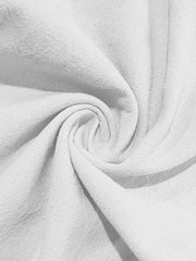 White sweatpants with drawstring detail and textured fabric