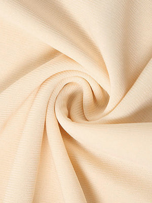 Backless ruffled mini dress in beige fabric with subtle vertical texture