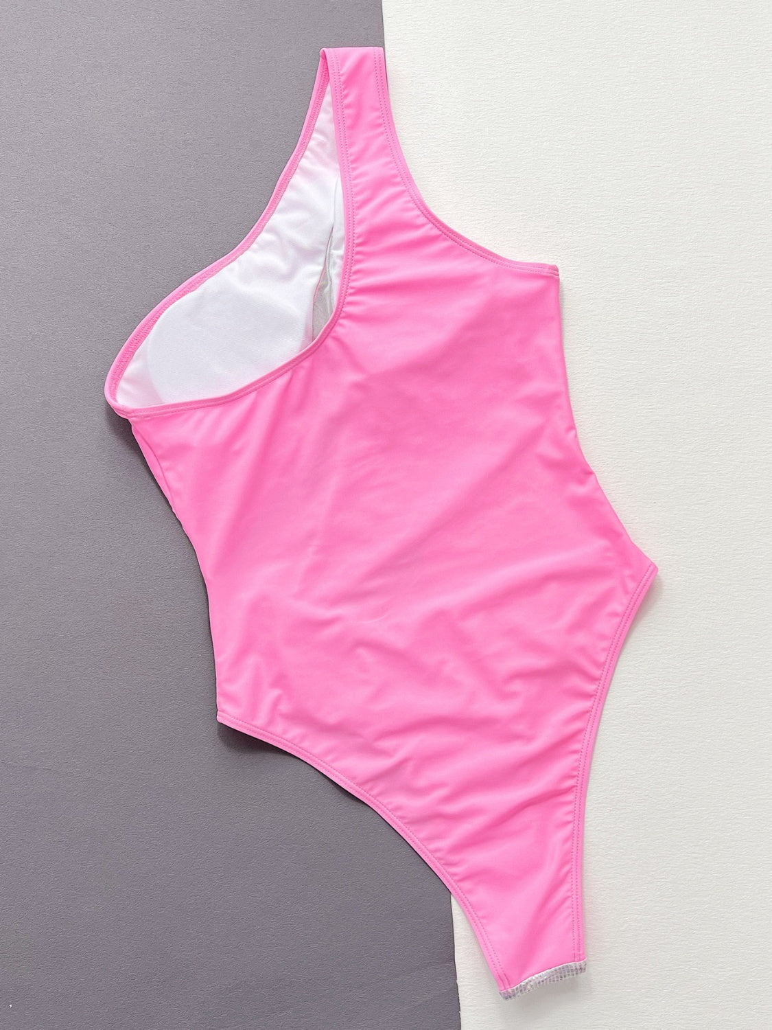 Hot pink one-shoulder swimsuit with sequin trim detail