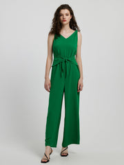 Emerald green tie-waist wide leg jumpsuit with V-neck and sleeveless design