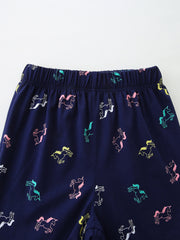 Navy cotton toddler sleepwear pants with colorful unicorn print and elastic waistband.