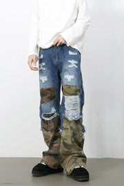 Camouflage patchwork distressed baggy jeans with ripped detailing and frayed hems.