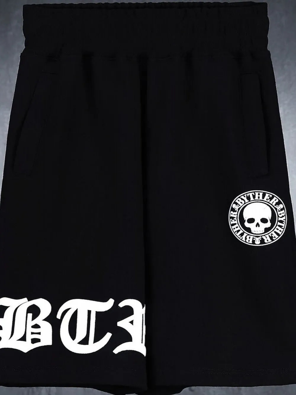 Black Gothic Script Graphic Shorts with skull logo detail