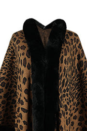 Leopard print cape with black faux fur trim and collar.