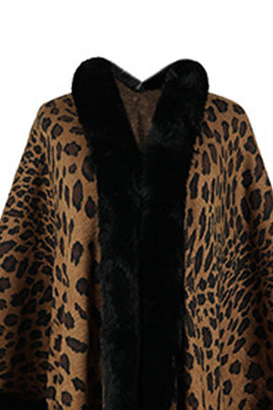 Leopard print cape with black faux fur trim and collar.