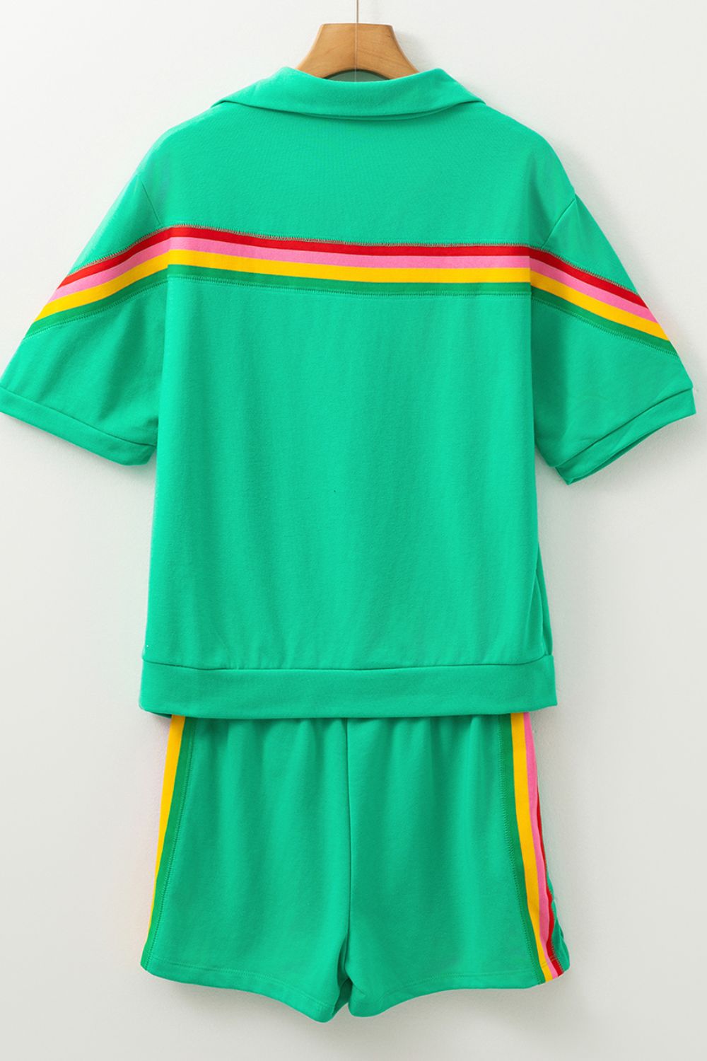 Green activewear set with rainbow stripe detail on top and shorts