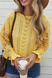 Yellow openwork knit sweater with lace sleeves and a crew neck.