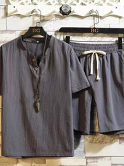 Gray cotton two-piece set with drawstring shorts and henley shirt.
