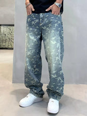 Loose-fit denim jeans with all-over bird print and vintage wash.